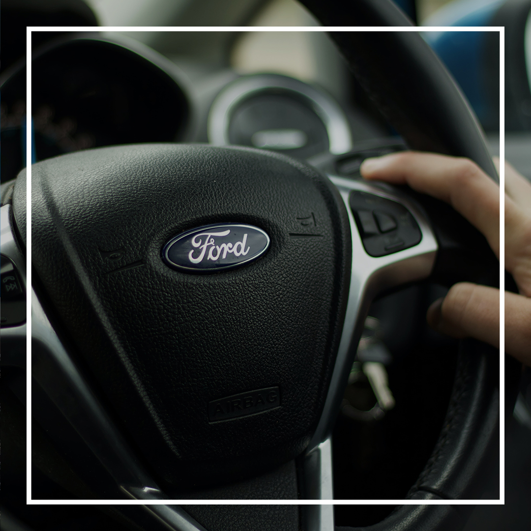 Car steering wheel with Ford logo on the front